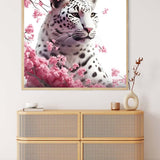 Painting of a snow leopard with blooming roses on a wall above a modern wicker drawer unit