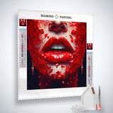 AB Diamond Painting - Red Lips artwork with tools, showcasing sparkling mosaic of red crystals creating lip design.