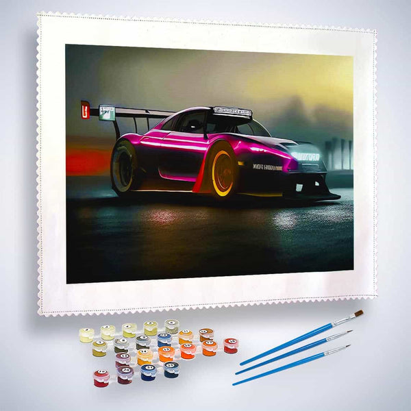 Paint by numbers kit featuring a sports car in a race with included paint pots and brushes
