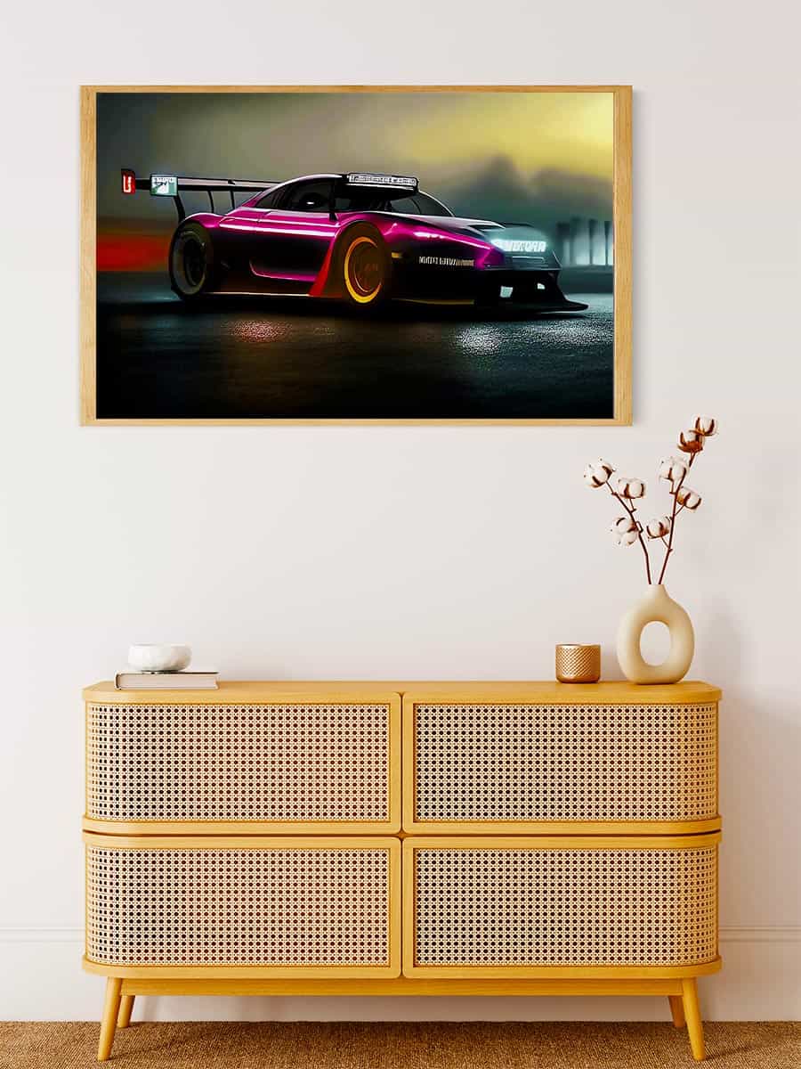 Painting of a sportscar racing at night framed on a wall above a stylish wooden dresser with decorative items.